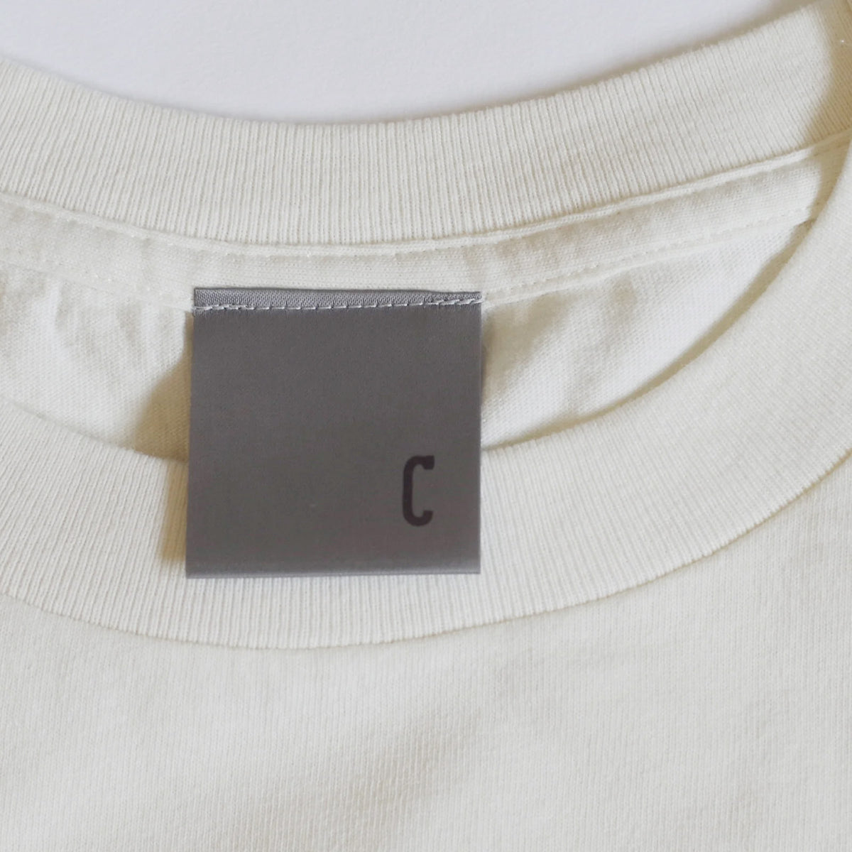 comolebi plants LOGO TEE KOREA [FADE WASHED WHITE/brown]